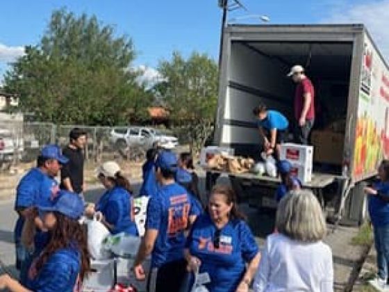 Volunteers unloading a truck.